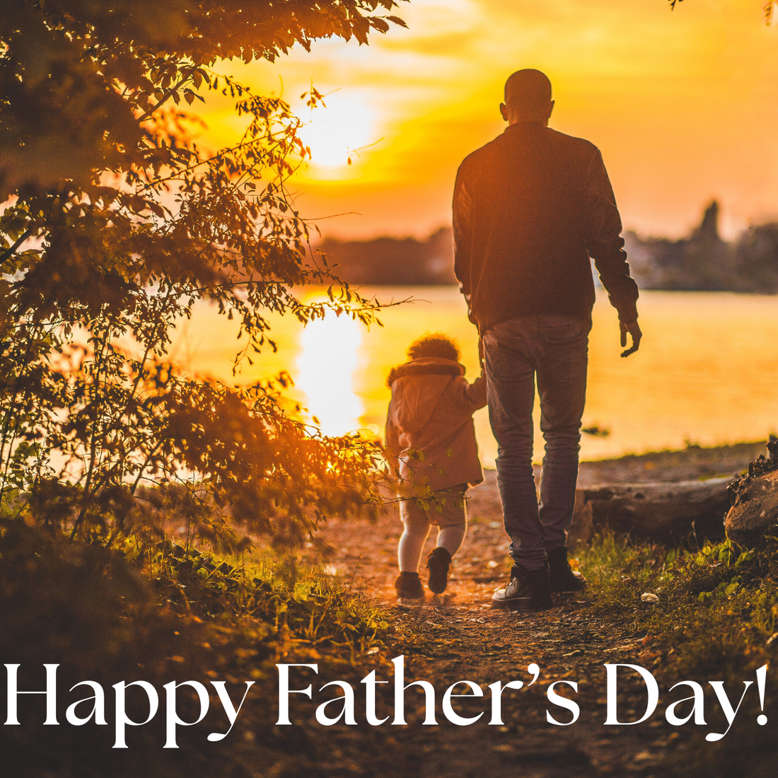 father and daughter walking hand-in-hand towards a sunset by a lake with the words Happy Father's Day