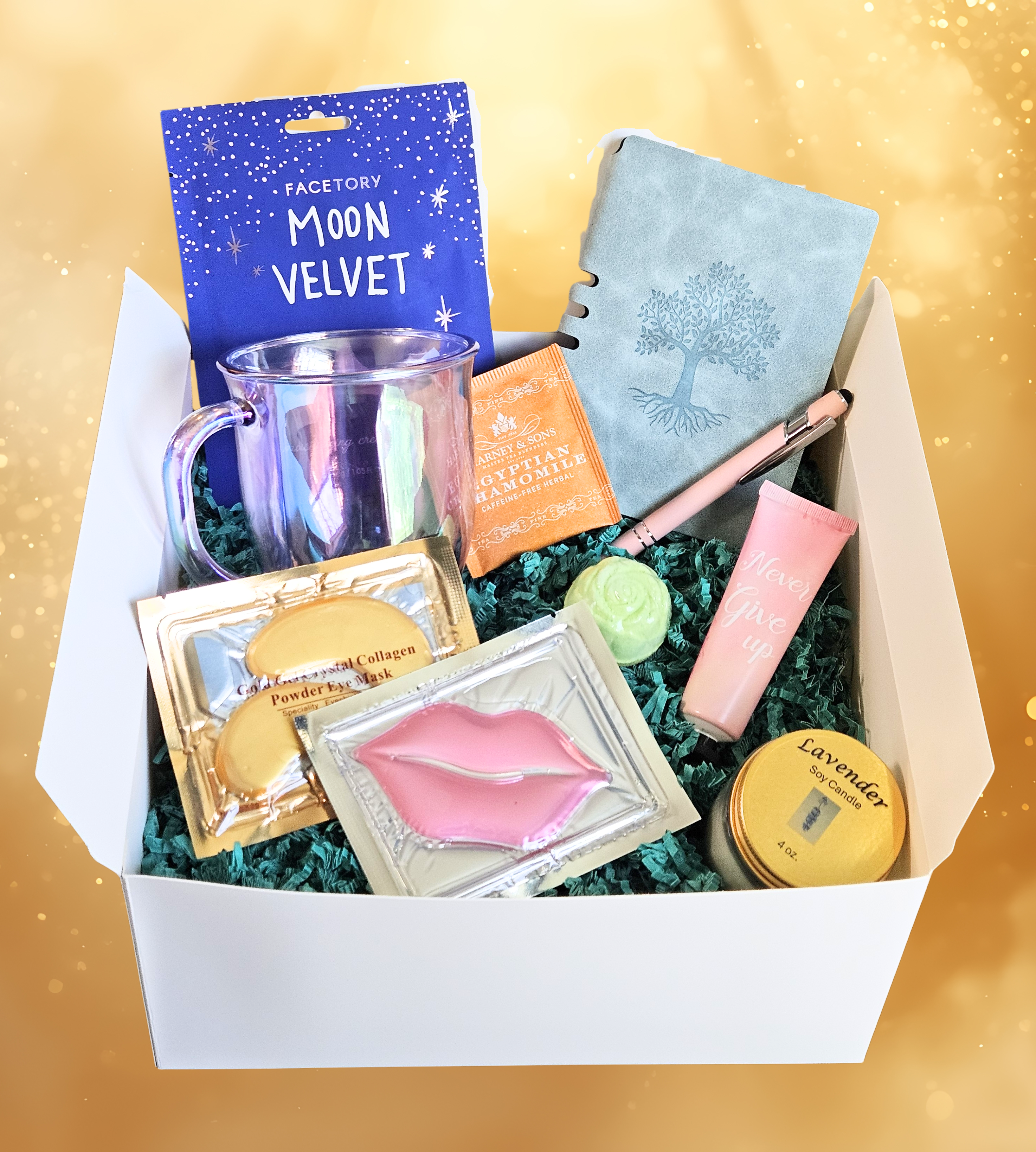Relax and Recharge gift box with face mask, eye and lip masks, lavender candle, bath bomb, lotion, journal and pen, iridescent mug, and tea bag arranged in the box