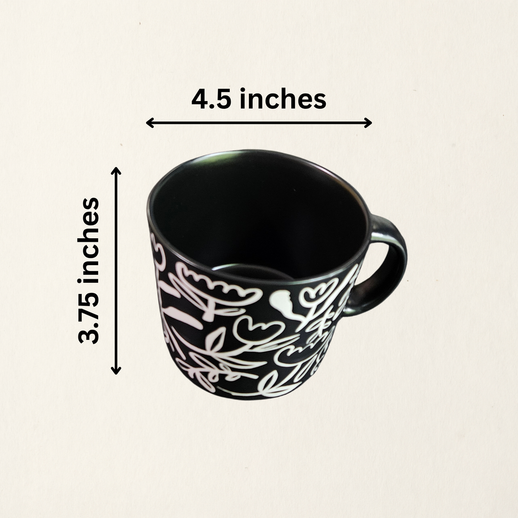 A ceramic soup mug with a modern floral design  with measurements, available in black with white flowers or white with black flowers.
