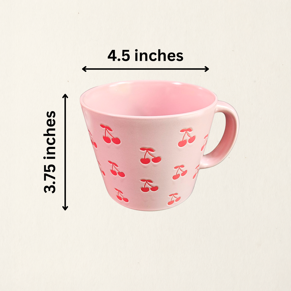 A ceramic soup mug with red cherry designs and a silicone‑sealed plastic lid featuring an adjustable dial and venting hole with measurements, available in pink or white.
