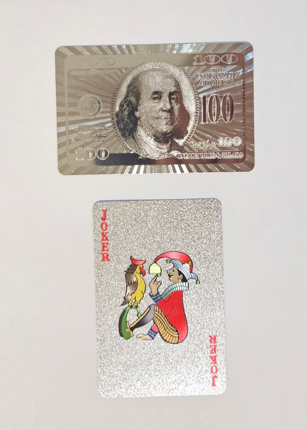 luxury waterproof playing cards with $100 bill design and 24K foil‑style finish for curated gift boxes