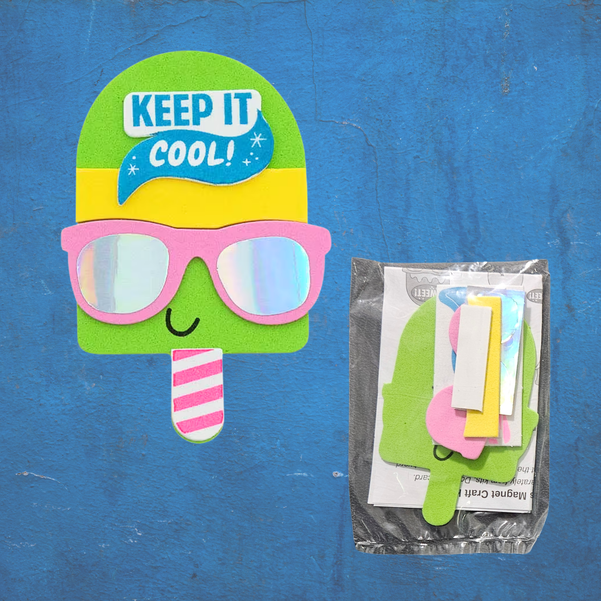 Popsicle-shaped foam craft with sunglasses and 'KEEP IT COOL' text on a blue background