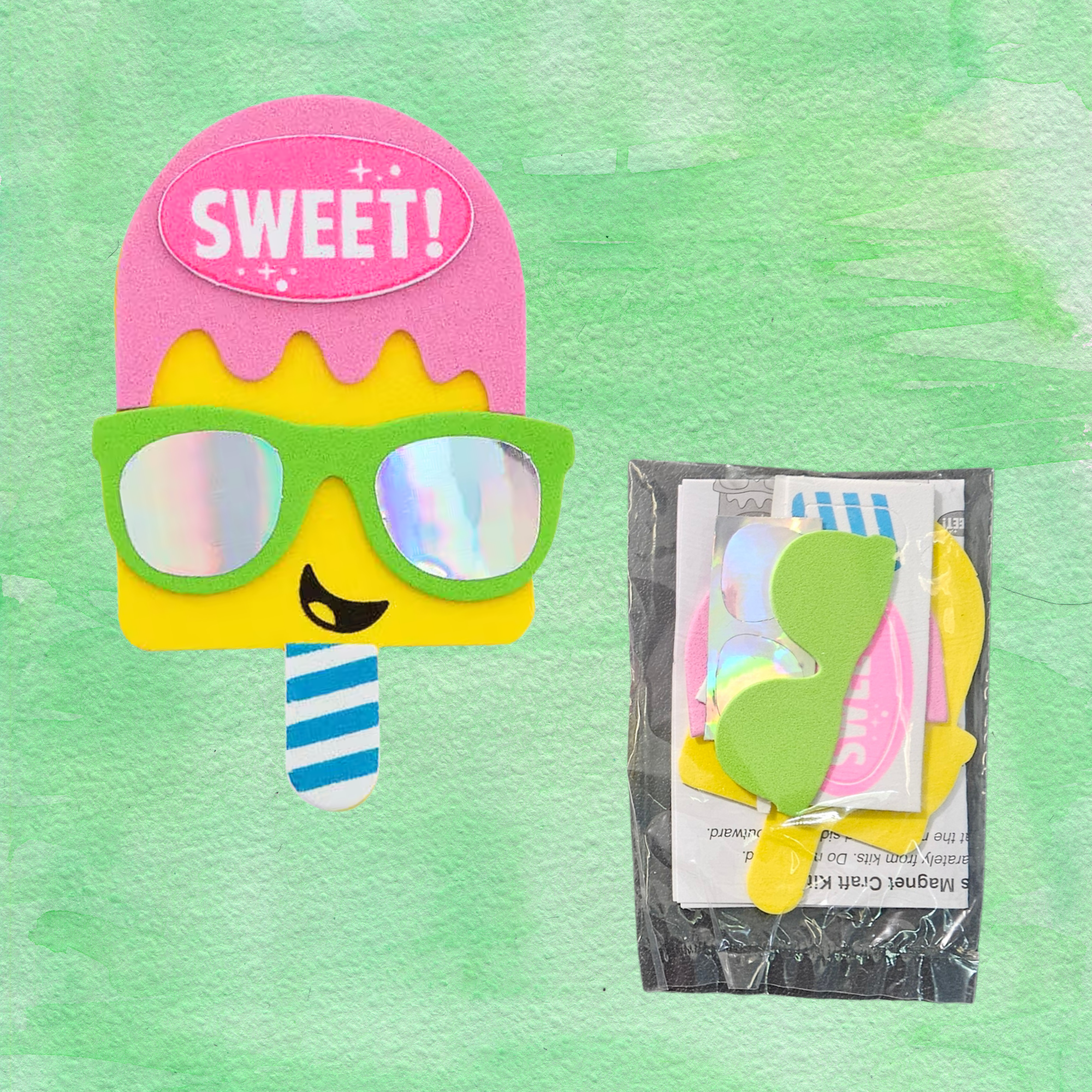 Popsicle-shaped foam craft with sunglasses and 'SWEET' text on a green background