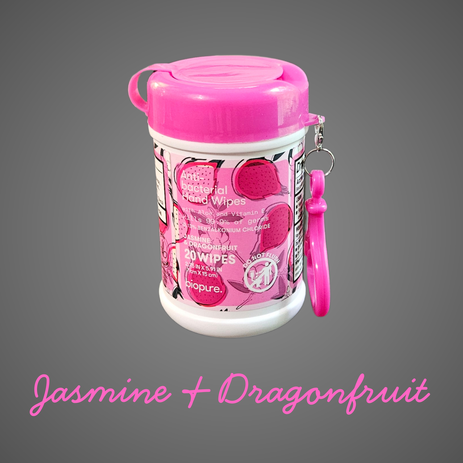 A pink-lidded container of BioPure anti-bacterial hand wipes featuring dragonfruit illustrations and a matching carry clip, shown on a gray background with “Jasmine + Dragonfruit” written below.