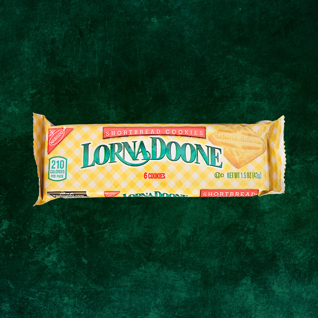 A single Lorna Doone shortbread cookie 6-pack in its yellow-and-white checkered wrapper, centered on a dark green textured background.