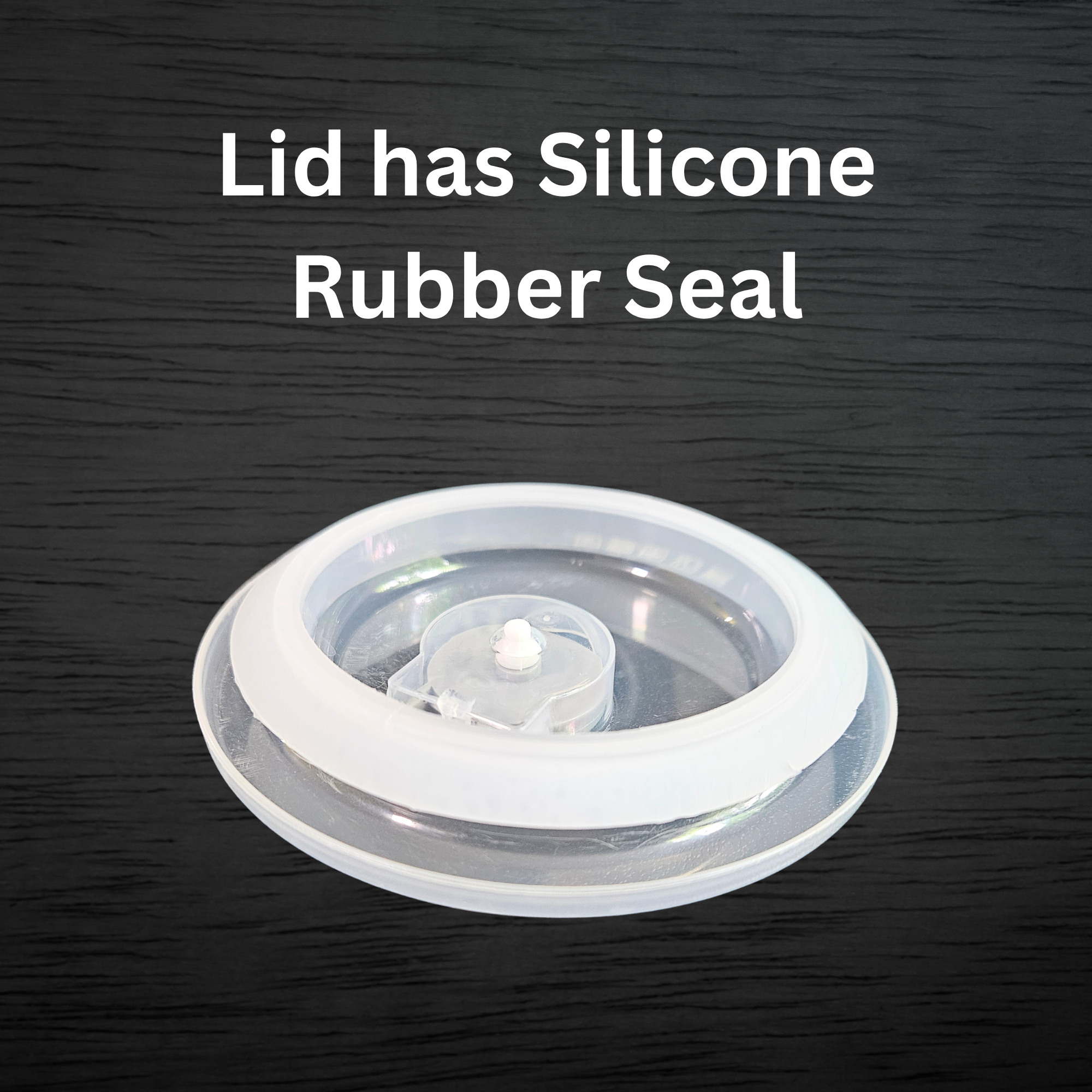 Clear plastic soup mug lid with silicone rubber seal.
