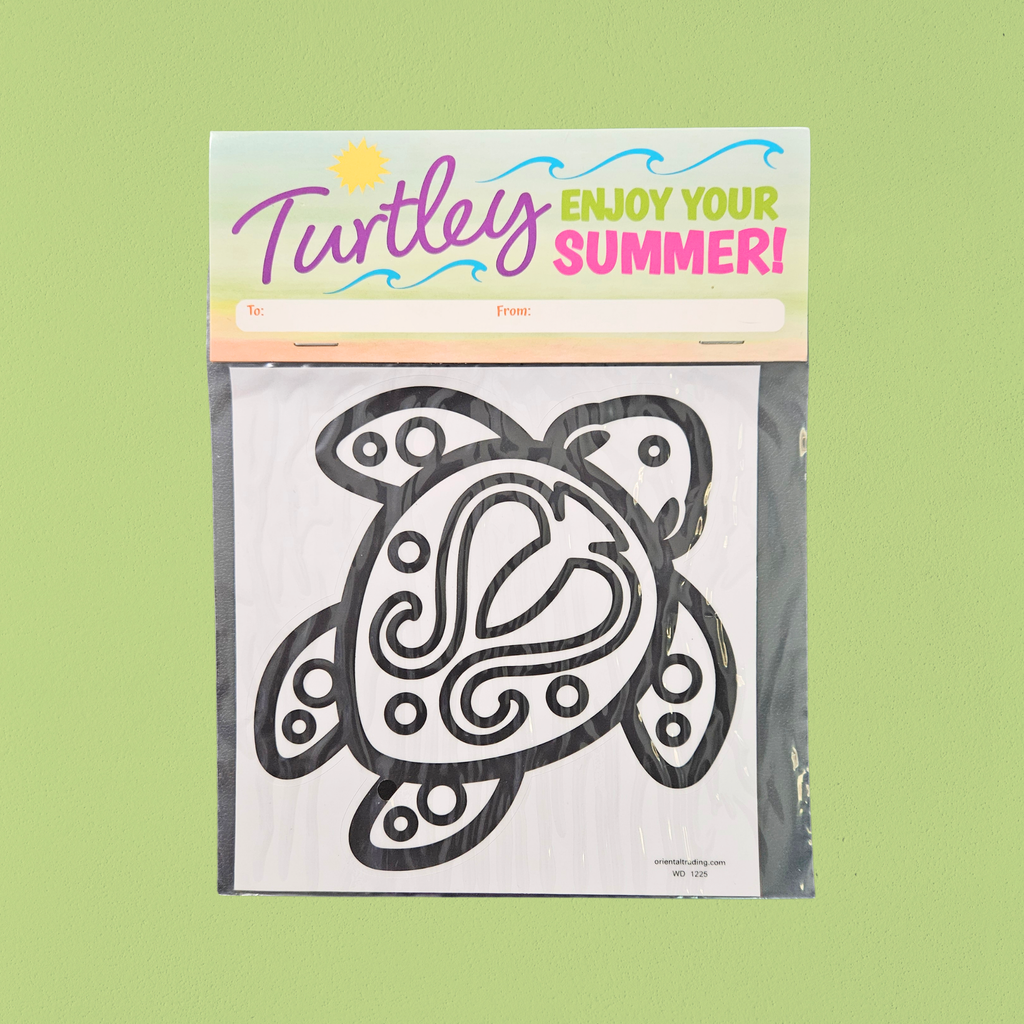 Packaged turtle-shaped window cling with 'Turtley Enjoy Your Summer!' text on a green background