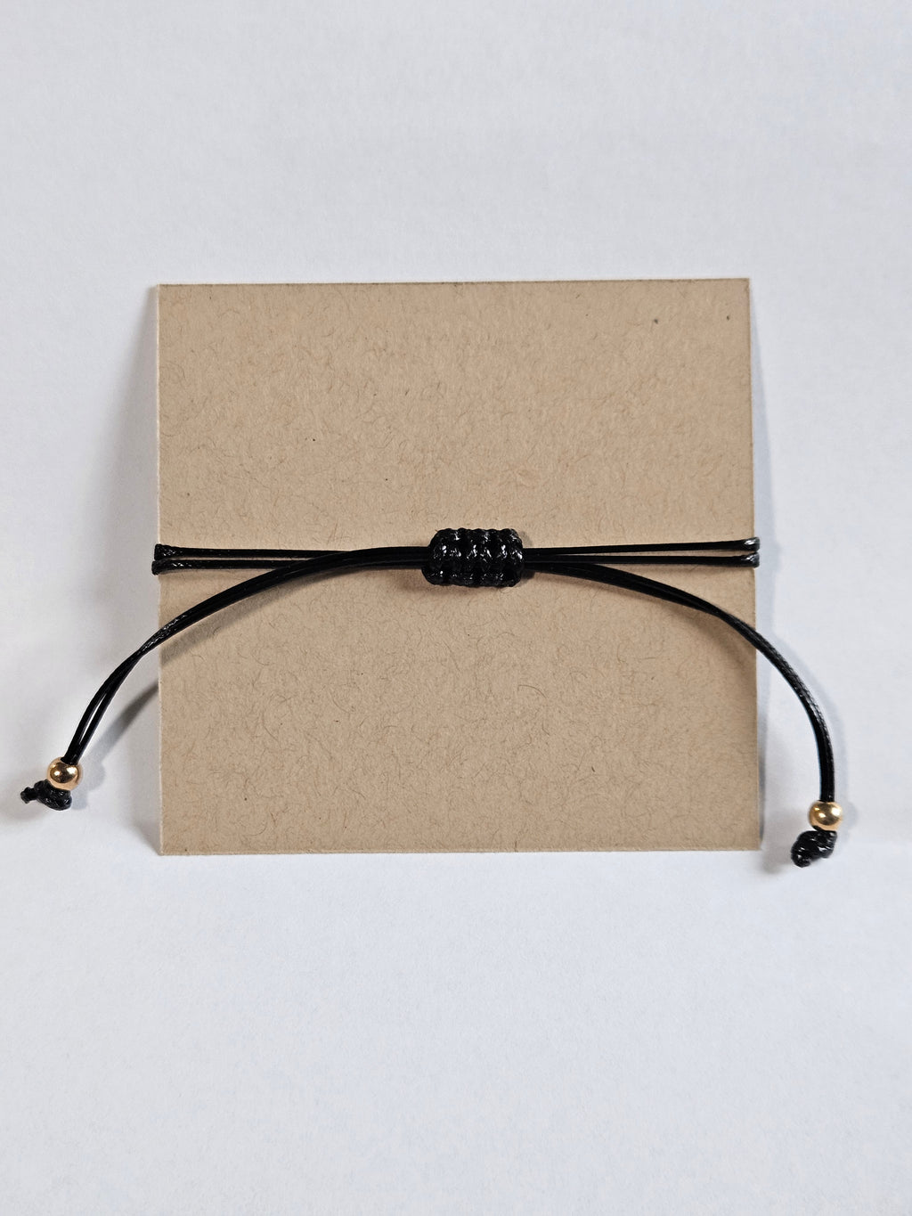 adjustable black wax rope bracelet with sunflower charm and inspirational saying for curated gift boxes